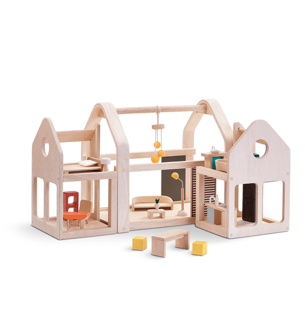 Houten poppenhuis met meubilair uitschuifbaar van Plan Toys